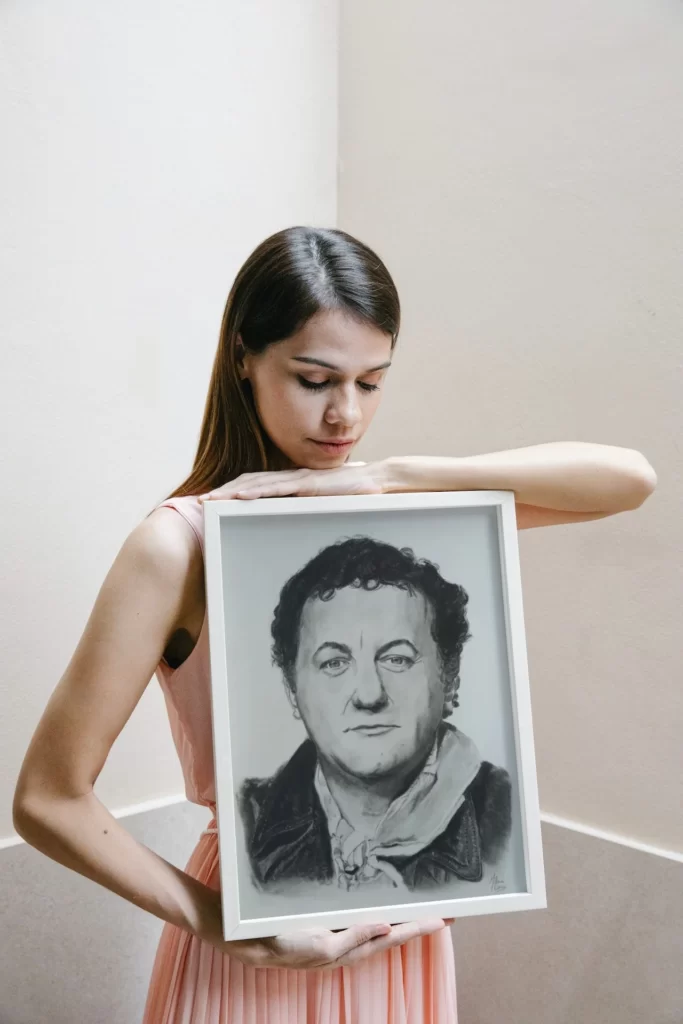 Portrait de Coluche dans un cadre